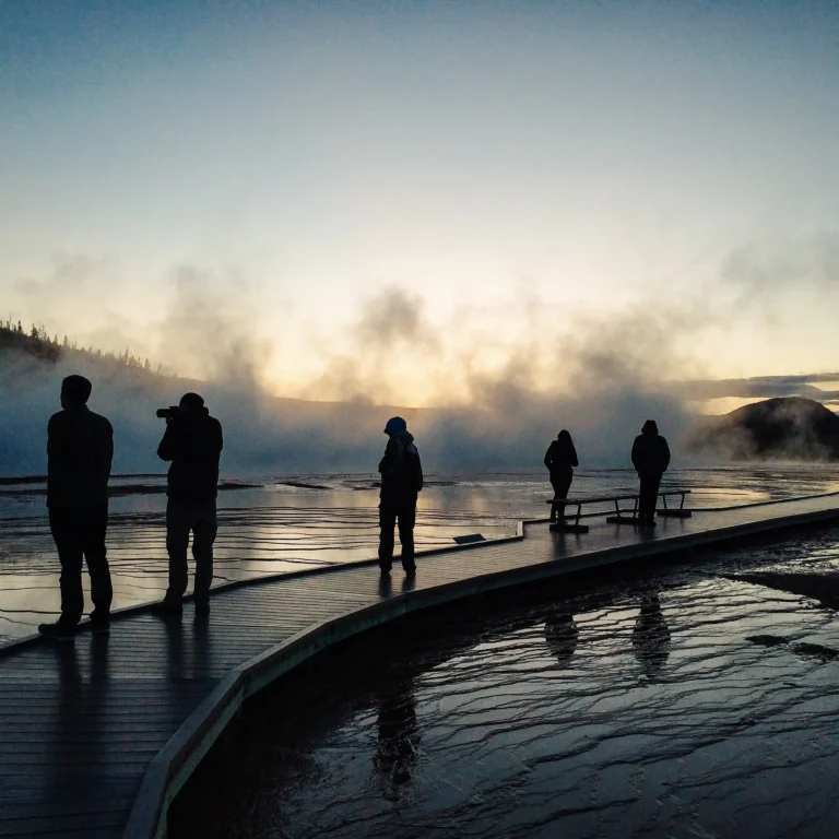 Tourists walking past hot spring